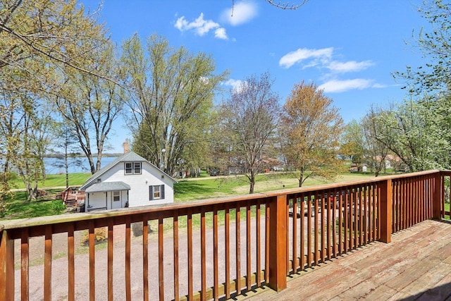 4121 1st Ave, Briggsville, WI 53920 - deck featuring an outbuilding and a lawn
