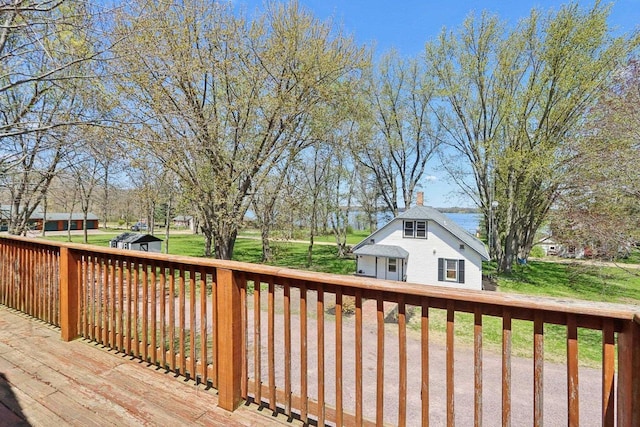 4121 1st Ave, Briggsville, WI 53920 - wooden deck featuring an outbuilding and a lawn