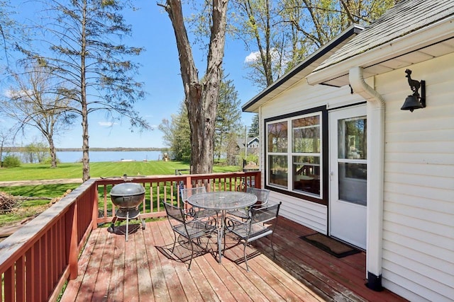 4121 1st Ave, Briggsville, WI 53920 - wooden terrace featuring a water view, outdoor dining space, a yard, and a grill