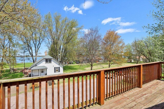 4121 1st Ave, Briggsville, WI 53920 - deck featuring an outbuilding and a lawn