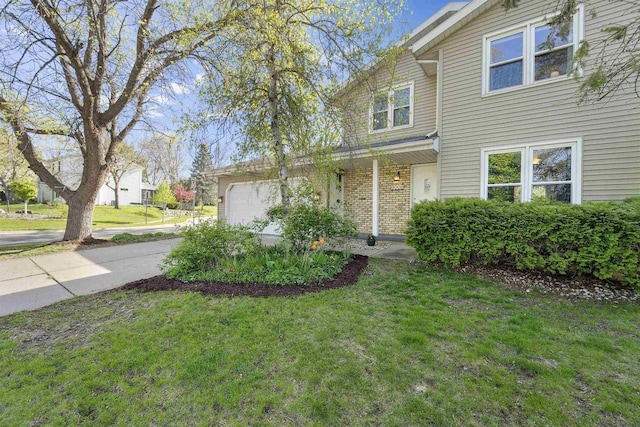 5719 Highland Way, Middleton, WI 53562 - traditional home featuring a garage, a front lawn, driveway, and brick siding