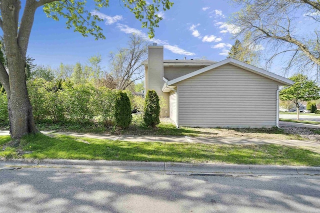 5719 Highland Way, Middleton, WI 53562 - view of property exterior with a chimney