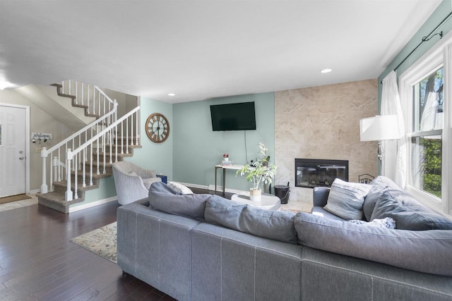 5719 Highland Way, Middleton, WI 53562 - living area with stairway, recessed lighting, wood finished floors, a premium fireplace, and baseboards