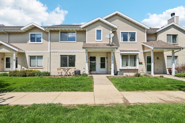6941 Chester Dr Unit C, Madison, WI 53719 - townhome / multi-family property with brick siding, a front lawn, and central AC
