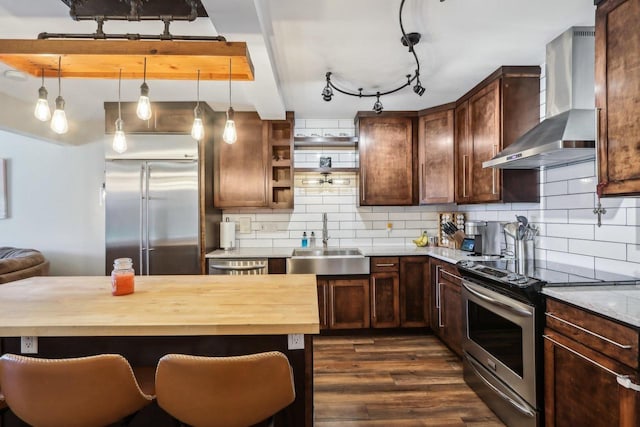 6941 Chester Dr Unit C, Madison, WI 53719 - kitchen featuring stainless steel appliances, a sink, wall chimney exhaust hood, butcher block countertops, and dark wood-style flooring