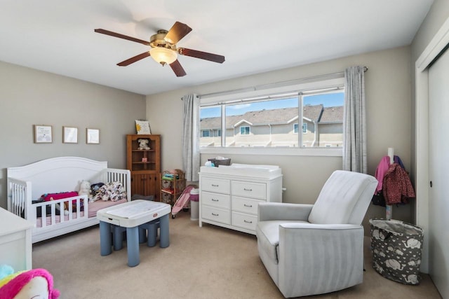 6941 Chester Dr Unit C, Madison, WI 53719 - bedroom with a crib, light colored carpet, a ceiling fan, and a closet