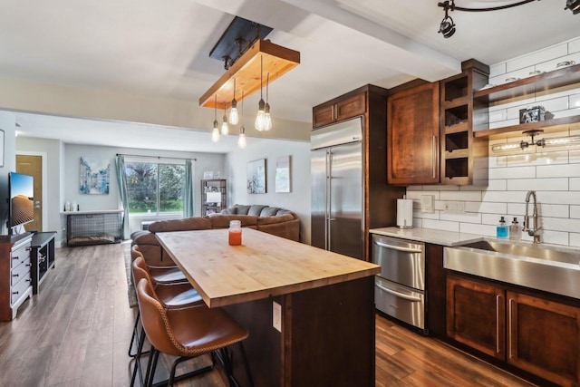 6941 Chester Dr Unit C, Madison, WI 53719 - kitchen featuring wooden counters, a sink, open floor plan, built in fridge, and backsplash
