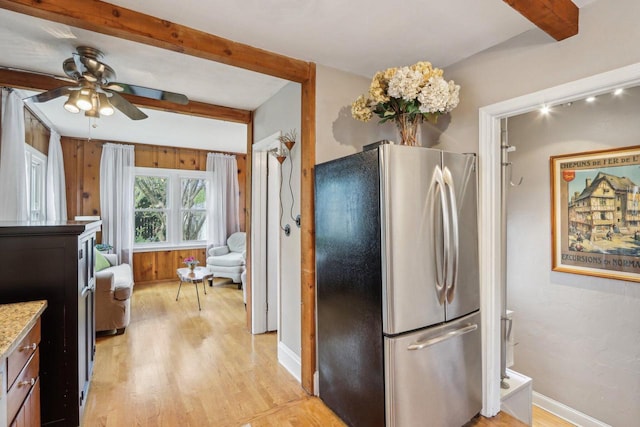 kitchen with freestanding refrigerator, beam ceiling, light wood-style floors, ceiling fan, and baseboards