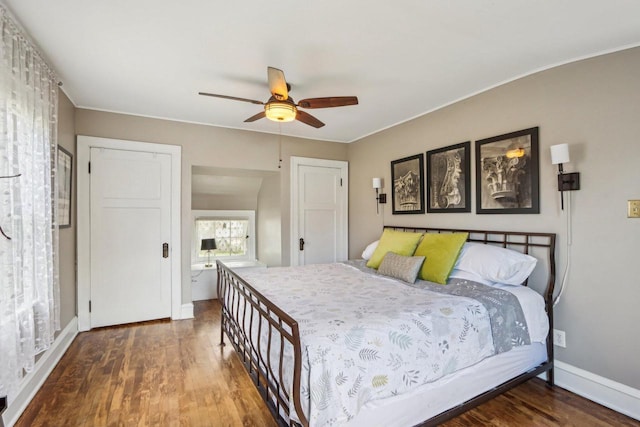 bedroom featuring wood finished floors, baseboards, a ceiling fan, and ornamental molding