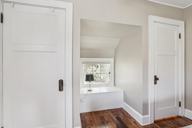 bathroom with wood finished floors and baseboards