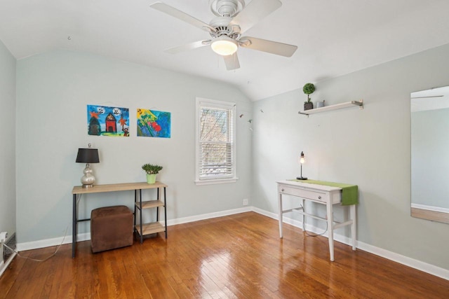 living area featuring lofted ceiling, wood finished floors, a ceiling fan, and baseboards