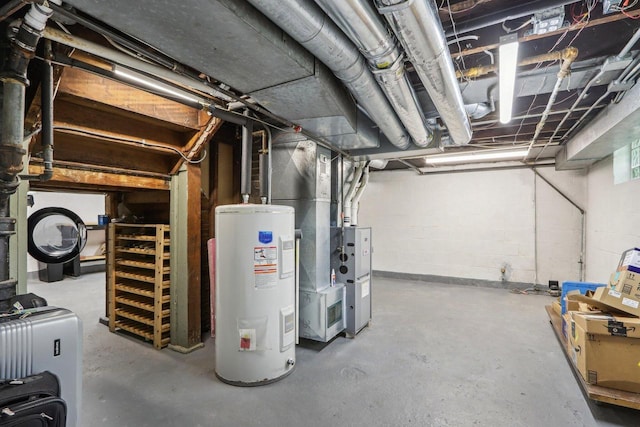 unfinished basement with electric water heater, heating unit, and concrete block wall