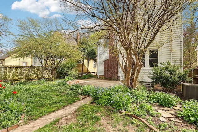 view of yard featuring fence and a patio area