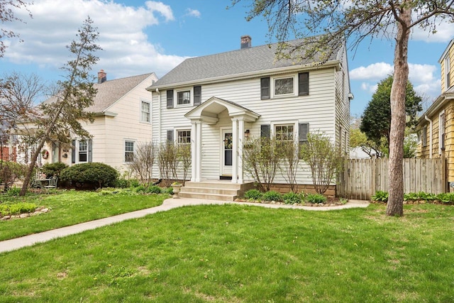 colonial-style house with a chimney