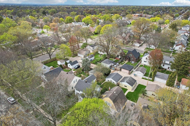 aerial view of property and surrounding area featuring nearby suburban area