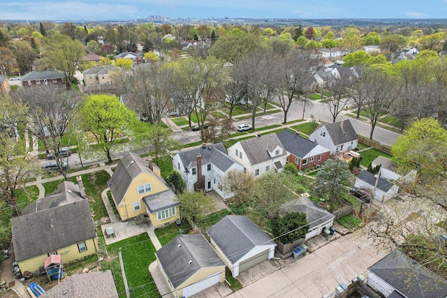 aerial view of property and surrounding area with nearby suburban area