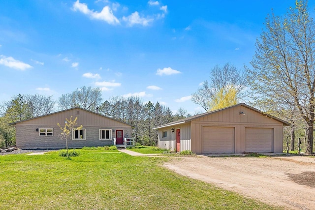 W3256 Princeton Rd, Green Lake, WI 54941 - single story home featuring a garage, a front lawn, and an outbuilding