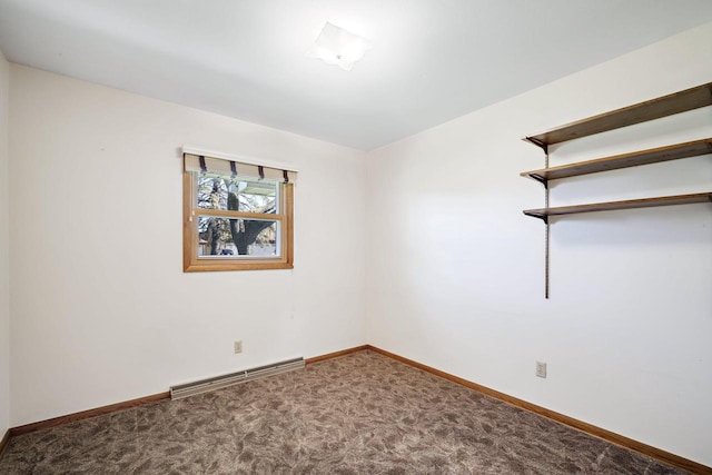7704 Salisbury Rd, West Bend, WI 53090 - carpeted spare room with baseboards and a baseboard radiator