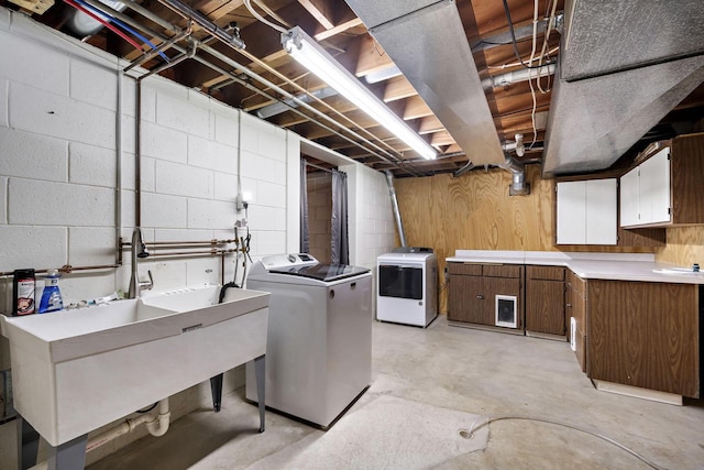 7704 Salisbury Rd, West Bend, WI 53090 - clothes washing area featuring independent washer and dryer and concrete block wall