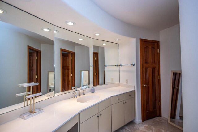 4455 Club Dr, Slinger, WI 53086 - bathroom with recessed lighting and vanity