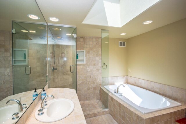 4455 Club Dr, Slinger, WI 53086 - full bath featuring recessed lighting, a stall shower, a garden tub, tile patterned flooring, and vanity