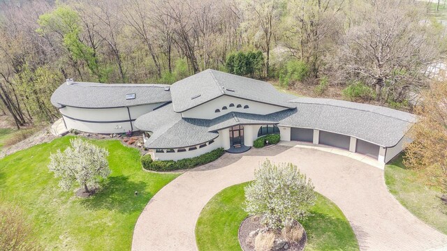 4455 Club Dr, Slinger, WI 53086 - aerial view of property and surrounding area with a heavily wooded area