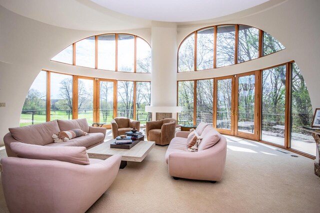 4455 Club Dr, Slinger, WI 53086 - carpeted living room with a towering ceiling and healthy amount of natural light