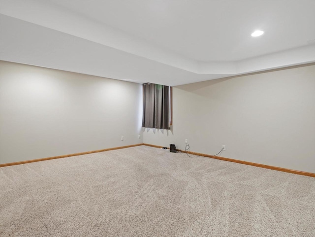 finished basement featuring carpet, baseboards, and recessed lighting