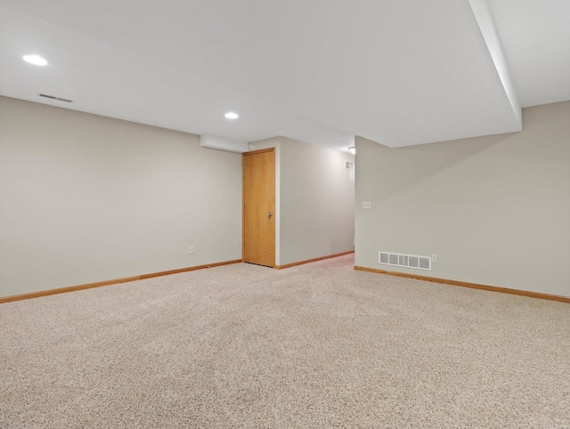 finished basement featuring recessed lighting, baseboards, and light carpet