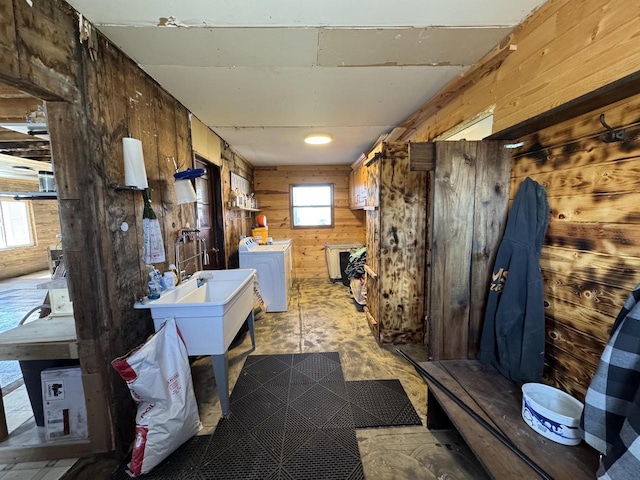 N3685 Mitchell Rd, Campbellsport, WI 53010 - misc room with wood walls, washer and dryer, and plenty of natural light