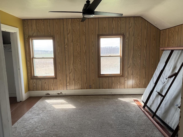 N3685 Mitchell Rd, Campbellsport, WI 53010 - unfurnished bedroom with multiple windows, lofted ceiling, baseboards, and ceiling fan