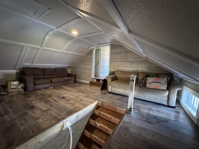 N3685 Mitchell Rd, Campbellsport, WI 53010 - additional living space featuring wood finished floors, lofted ceiling, and a textured ceiling