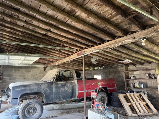 N3685 Mitchell Rd, Campbellsport, WI 53010 - garage featuring concrete block wall and wooden ceiling