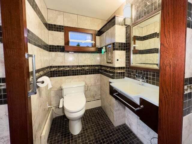 7814 2nd Ave, Kenosha, WI 53143 - bathroom featuring tile walls, toilet, tile patterned floors, and a baseboard radiator