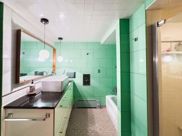 7814 2nd Ave, Kenosha, WI 53143 - bathroom featuring baseboard heating, tile walls, a shower, vanity, and a bath