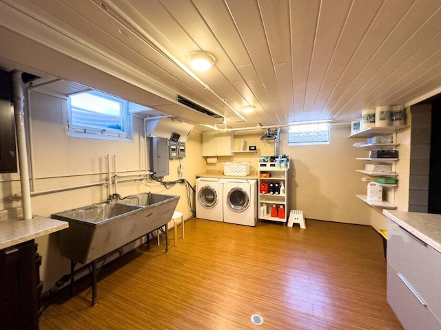 7814 2nd Ave, Kenosha, WI 53143 - clothes washing area featuring washing machine and clothes dryer, wood finished floors, and electric panel
