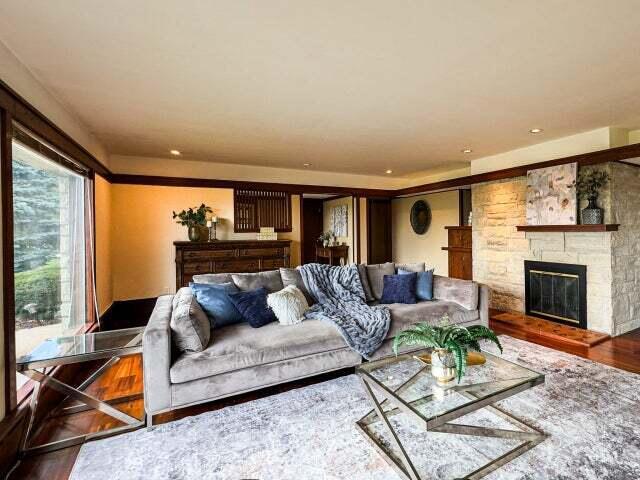 7814 2nd Ave, Kenosha, WI 53143 - living room with wood finished floors, a stone fireplace, and recessed lighting