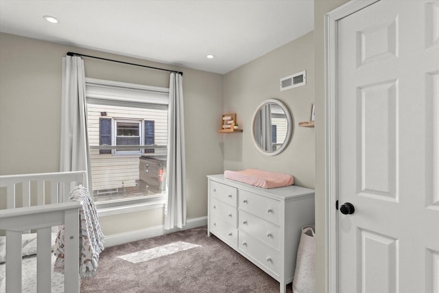 bedroom with carpet flooring, baseboards, recessed lighting, and a crib