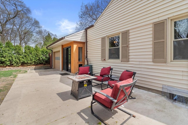 view of patio featuring an outdoor fire pit