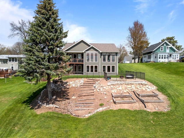 519 Park Ave, Little Chute, WI 54140 - back of house with a lawn and a balcony