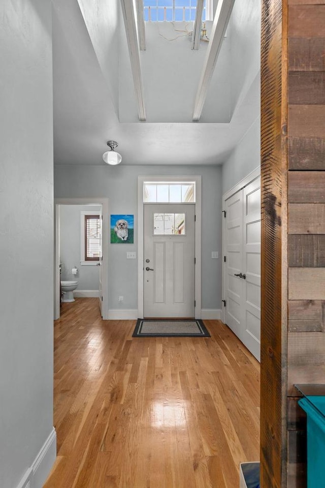 519 Park Ave, Little Chute, WI 54140 - foyer entrance with light wood finished floors, baseboards, and plenty of natural light