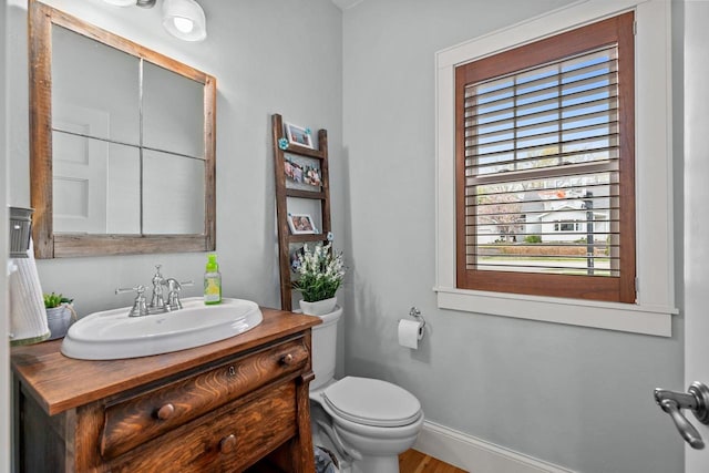 519 Park Ave, Little Chute, WI 54140 - half bath with toilet, vanity, baseboards, and wood finished floors