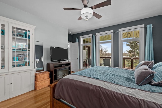 519 Park Ave, Little Chute, WI 54140 - bedroom featuring wood finished floors, ceiling fan, and access to outside
