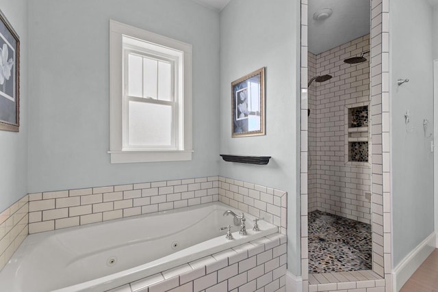 519 Park Ave, Little Chute, WI 54140 - full bath featuring tiled shower, a whirlpool tub, and baseboards