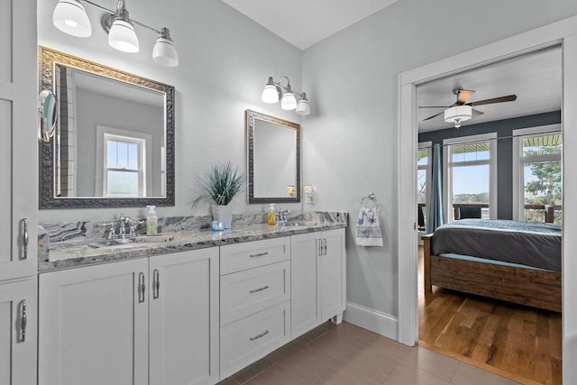 519 Park Ave, Little Chute, WI 54140 - full bath featuring plenty of natural light, ensuite bathroom, ceiling fan, and baseboards