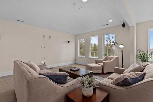 519 Park Ave, Little Chute, WI 54140 - living room featuring baseboards, wood finished floors, and recessed lighting