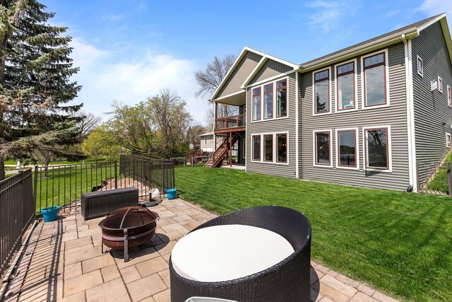519 Park Ave, Little Chute, WI 54140 - view of patio with an outdoor fire pit, stairs, and a wooden deck