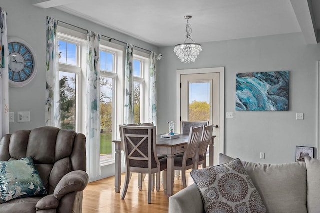 519 Park Ave, Little Chute, WI 54140 - dining space featuring a chandelier and light wood-type flooring