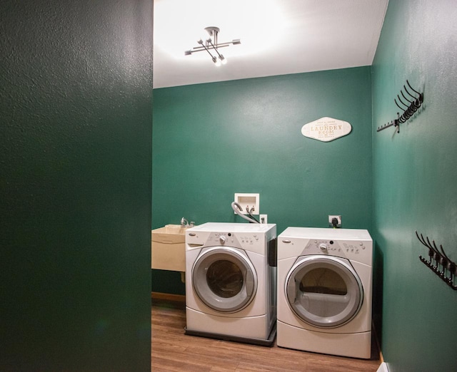 624 Westwynd Ct, Mazomanie, WI 53560 - washroom featuring wood finished floors and washer and dryer