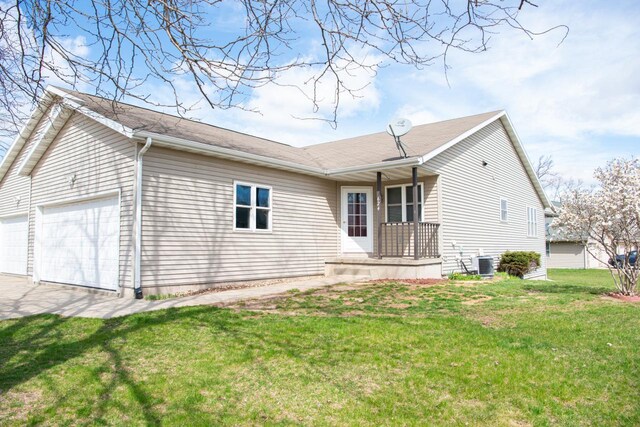 624 Westwynd Ct, Mazomanie, WI 53560 - view of front of property with central AC unit, an attached garage, a front lawn, and driveway